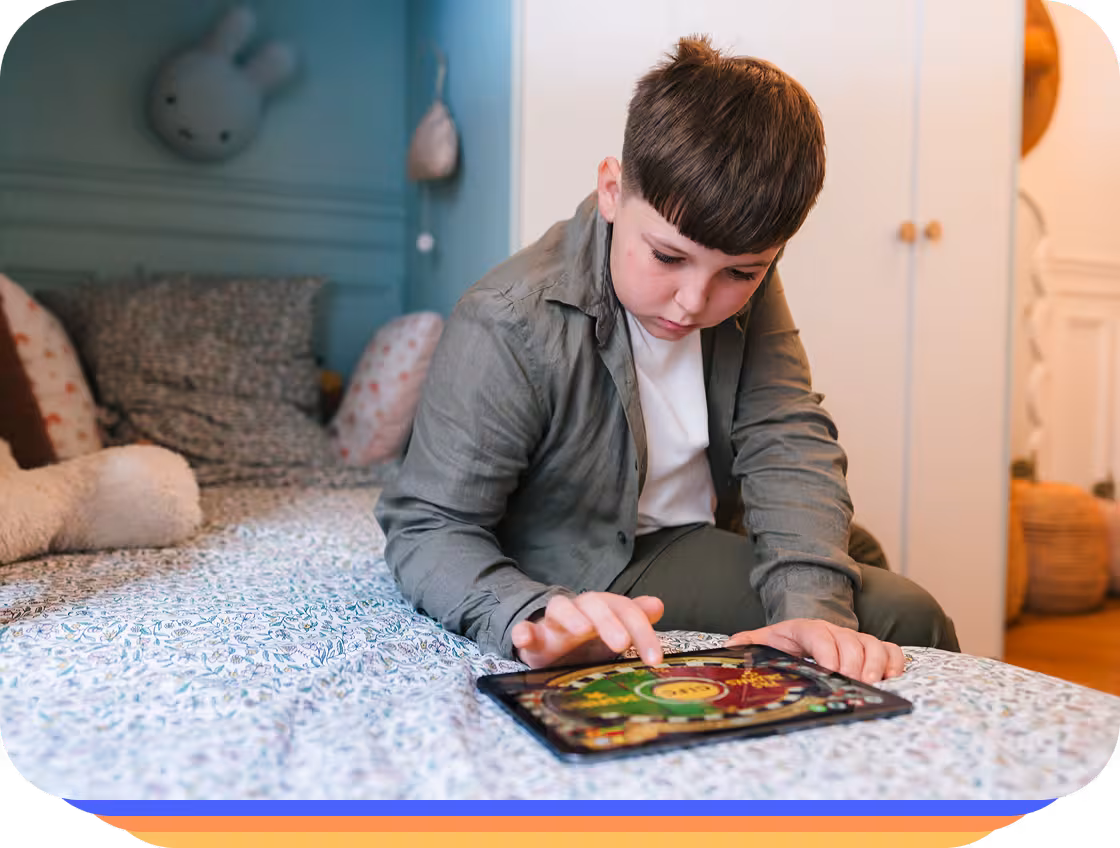 A child practicing reading on a tablet